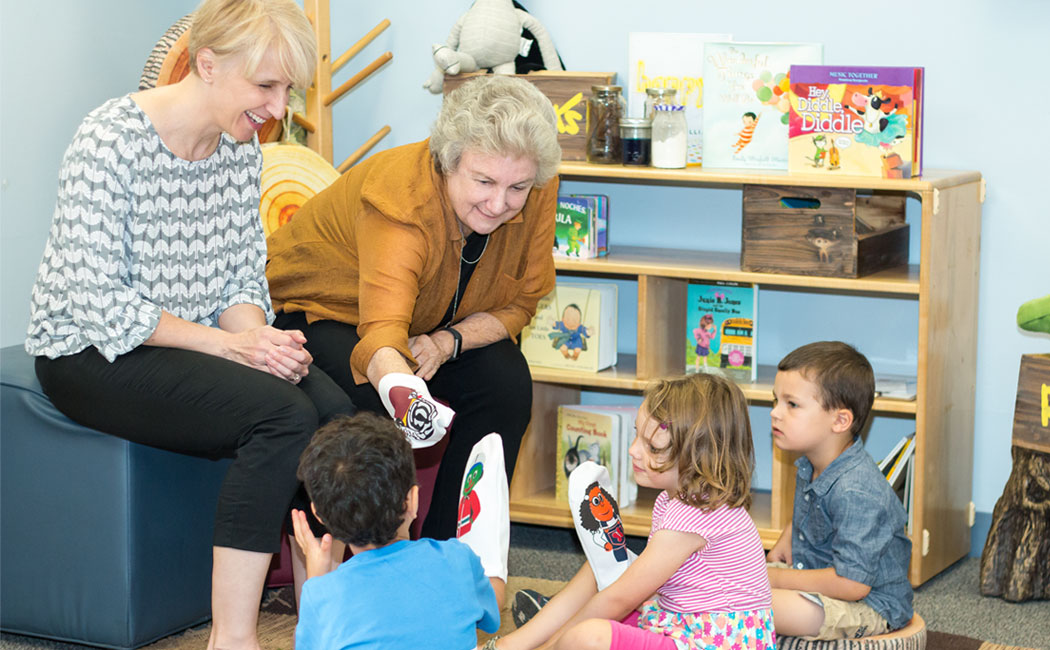 From left, Kathleen Rudasill and Gwen Nugent, co-principal investigators, introduce children to a few of the puppet characters of INSIGHTS.
