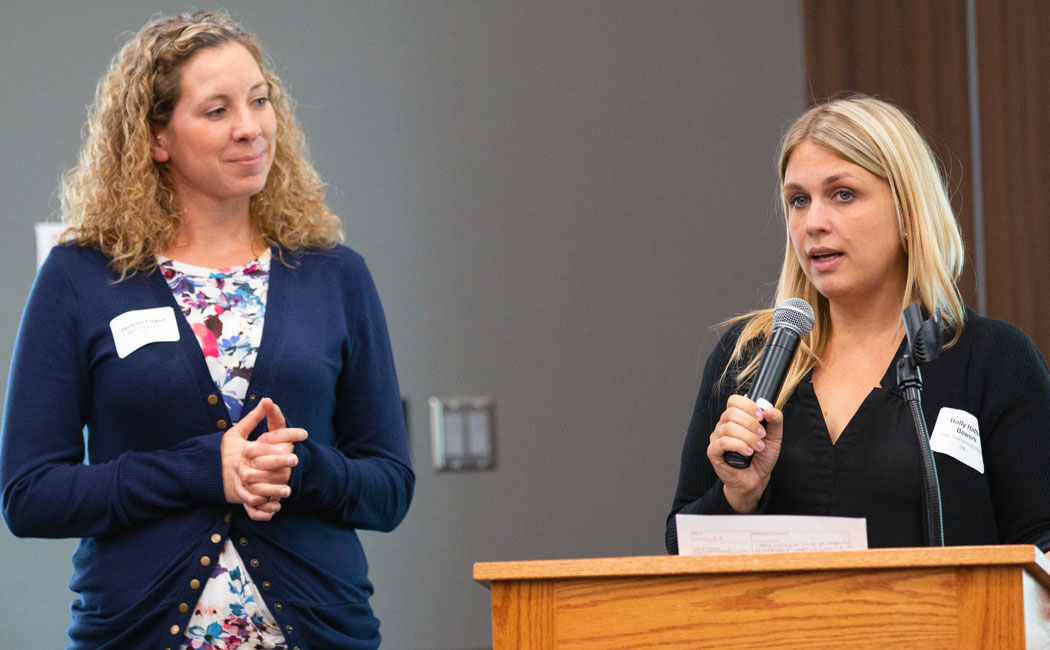 From left, Jaci Foged, Learning Child Extension educator, and Holly Hatton-Bowers, assistant professor of child, youth and family studies, share information on their collaborative project.