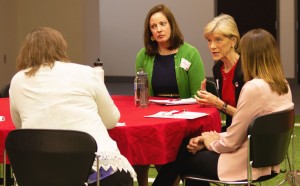 From center, the CYFS team of Lorey Wheeler, Susan Sheridan and Lisa Knoche answer some questions for a Lincoln Journal Star reporter.