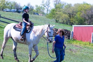 Jacob, 12, rides Leo as Horses for Healing Instructor Justy Hagan leads.