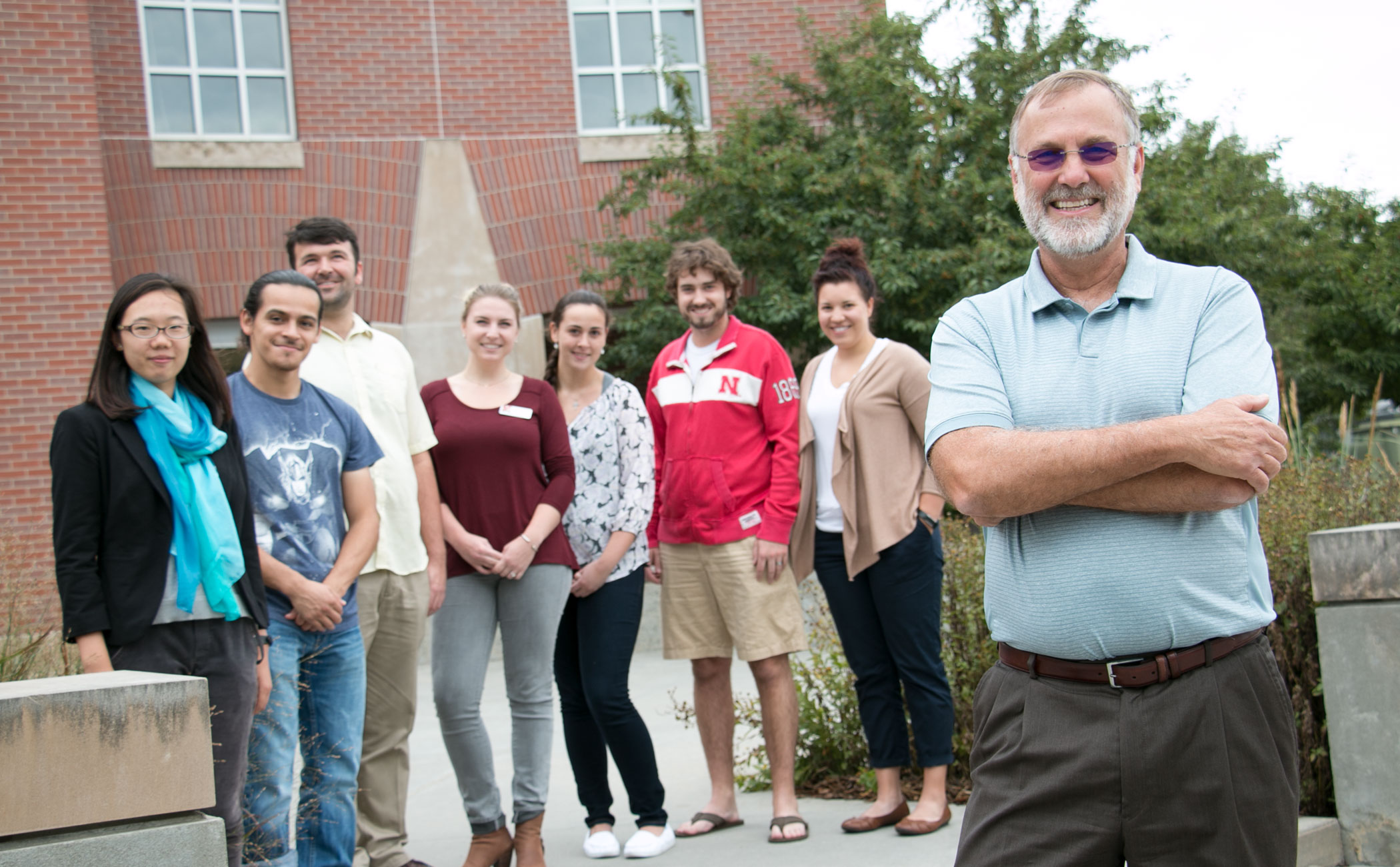Michael Scheel, right, with graduate students from the Building Bridges Program.