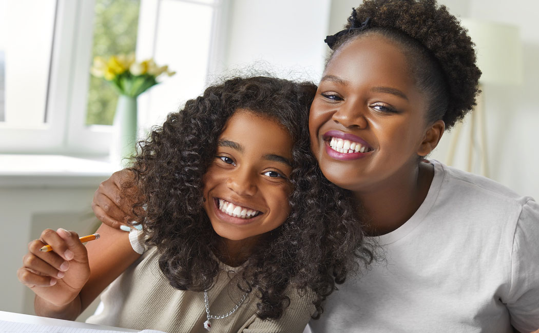 Parent and little child having fun playing educational toys