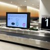 Nurture Nebraska digital signage in Lincoln Airport baggage claim area.